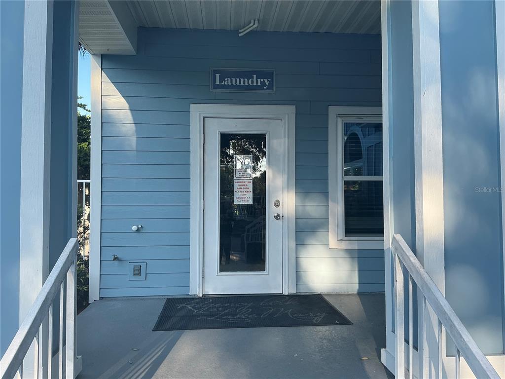715 Sugar Bay Way, Unit 107 Lake Mary, FL 32746 - Photo 26 of 48 a view of a hallway with wooden floor and staircase