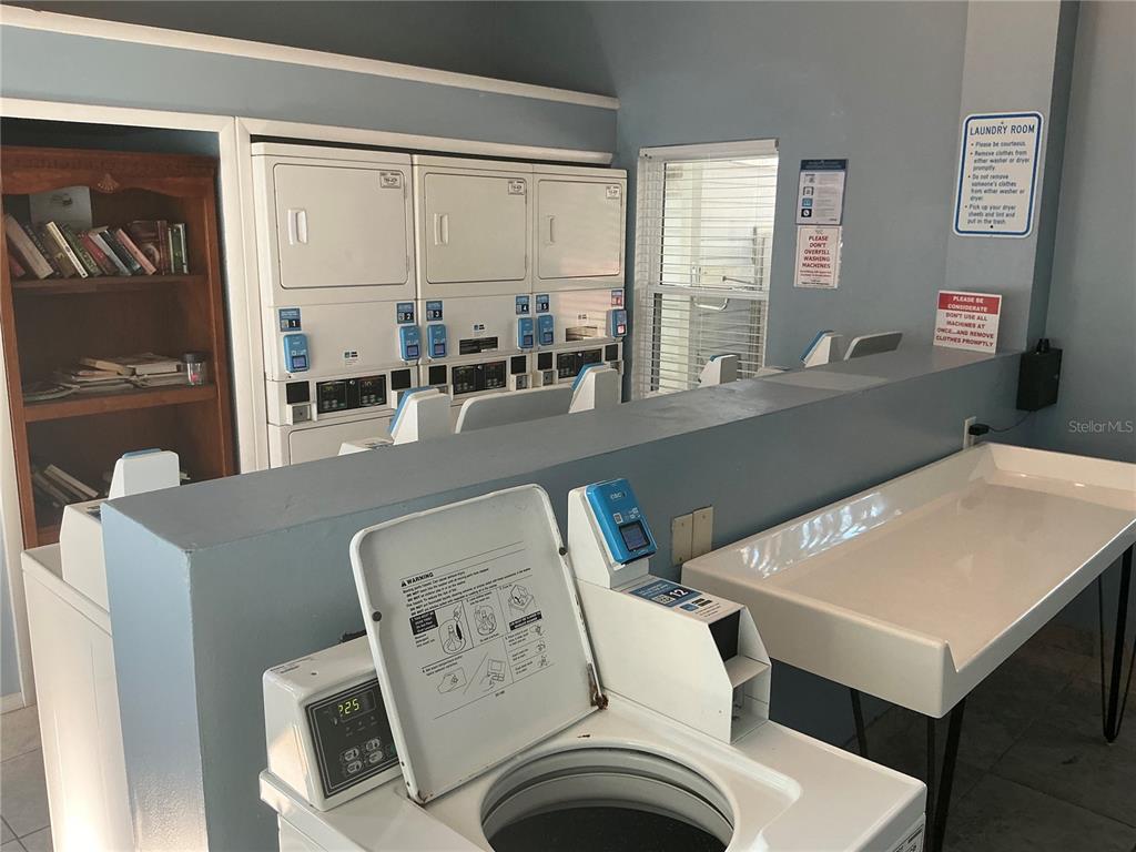 715 Sugar Bay Way, Unit 107 Lake Mary, FL 32746 - Photo 28 of 48 a living room with furniture and window