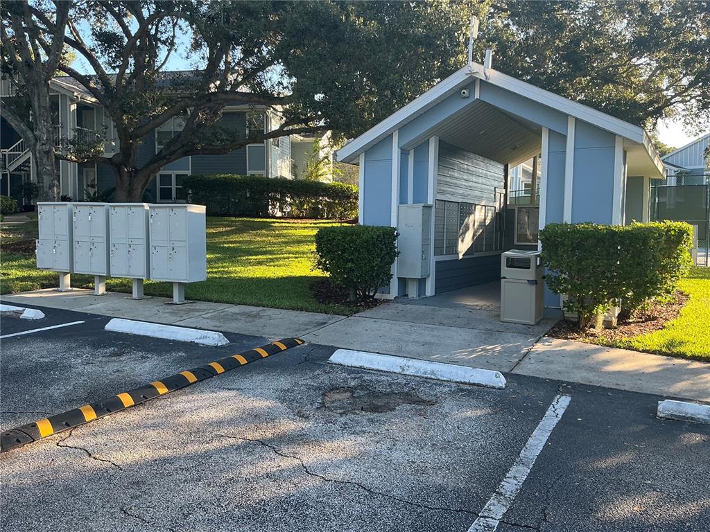 715 Sugar Bay Way, Unit 107 Lake Mary, FL 32746 - Photo 29 of 48 a front view of a house with a yard