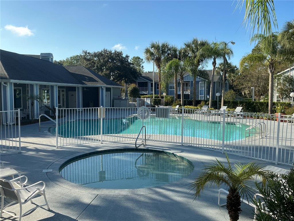 715 Sugar Bay Way, Unit 107 Lake Mary, FL 32746 - Photo 35 of 48 a view of a swimming pool with a patio