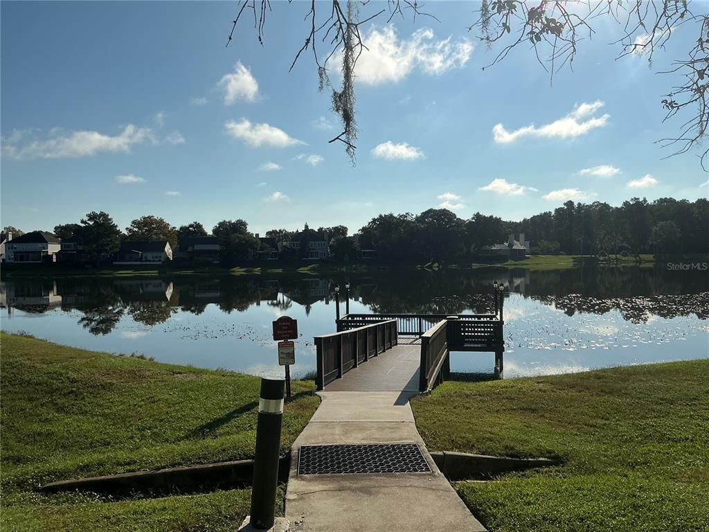 715 Sugar Bay Way, Unit 107 Lake Mary, FL 32746 - Photo 47 of 48 a view of a lake with a floor to ceiling window