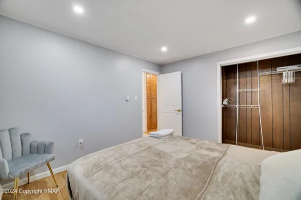 a bedroom with a bed and furniture