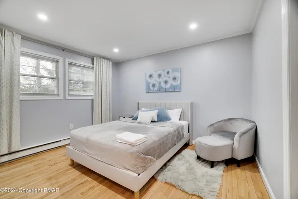 a bedroom with a bed and a couch