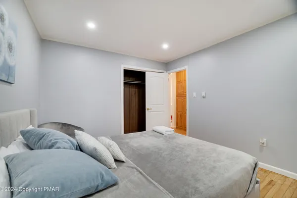 a bed room with a bed and a couch