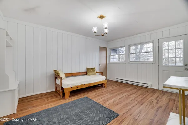 a spacious bedroom with a bed and a window