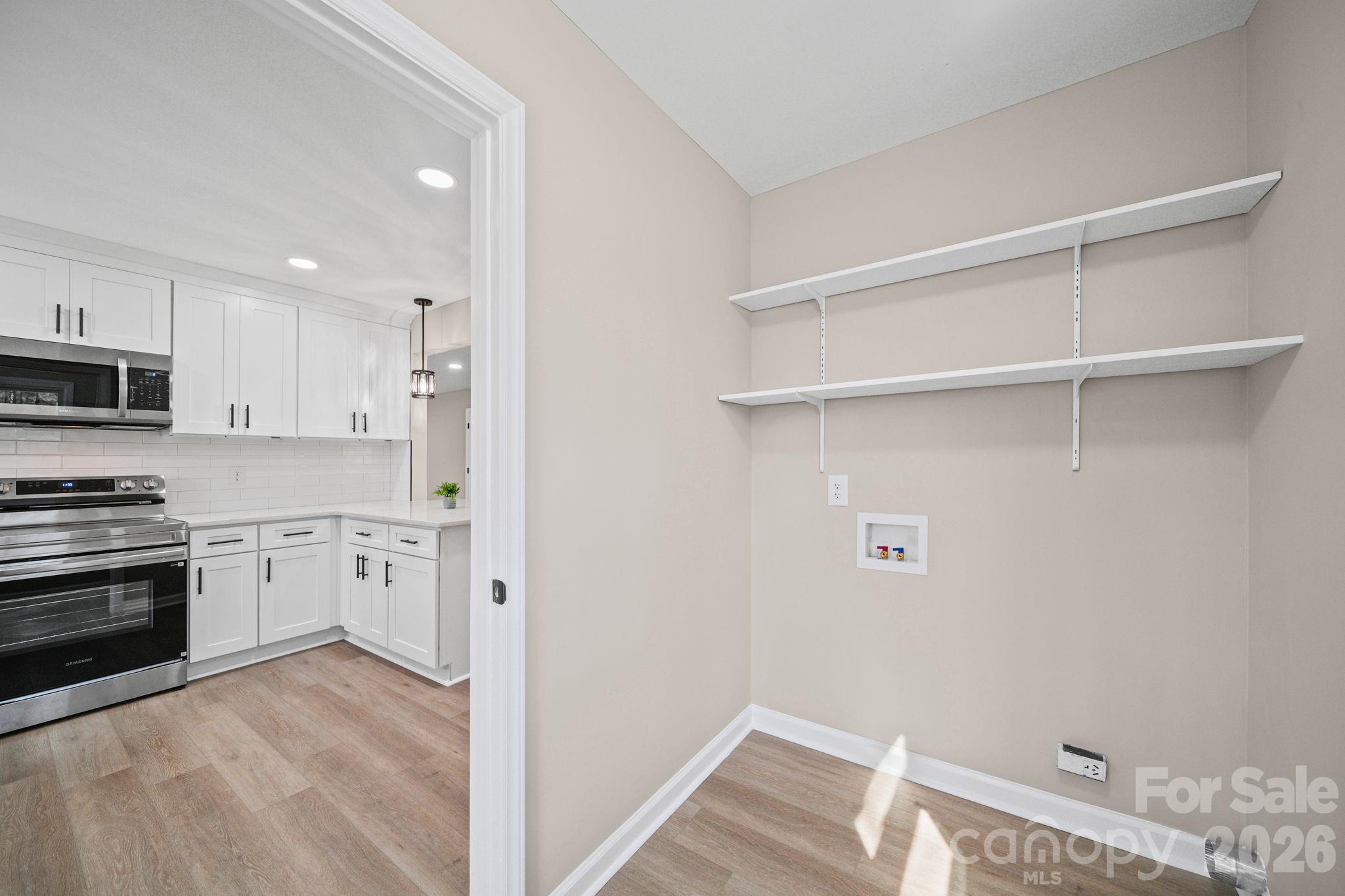 5808 Flint Ridge Marshville, NC 28103 - Photo 12 of 38 a view of a kitchen with electric appliances