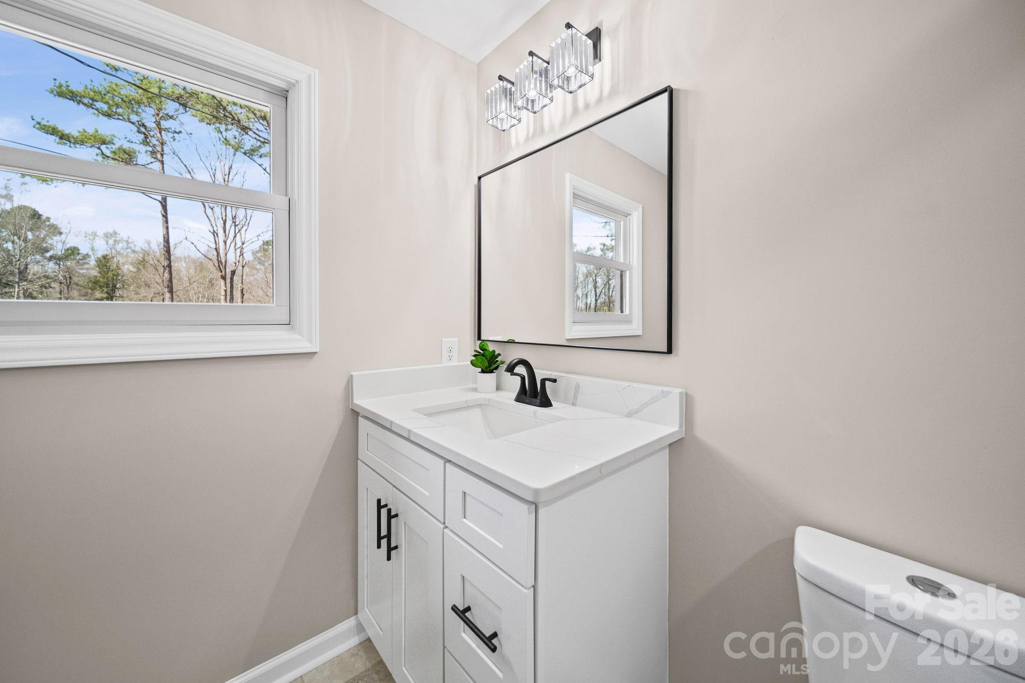 5808 Flint Ridge Marshville, NC 28103 - Photo 17 of 38 a bathroom with a sink and a mirror