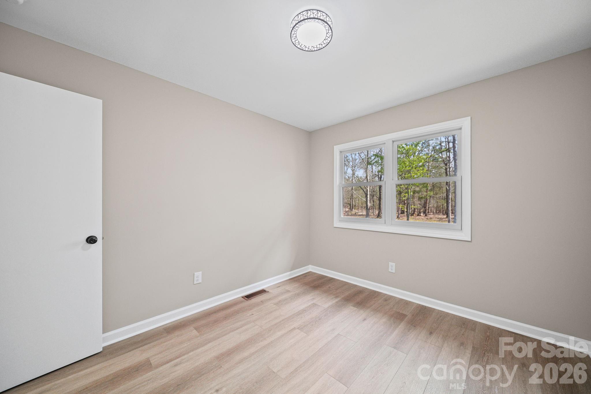 5808 Flint Ridge Marshville, NC 28103 - Photo 28 of 38 an empty room with a window