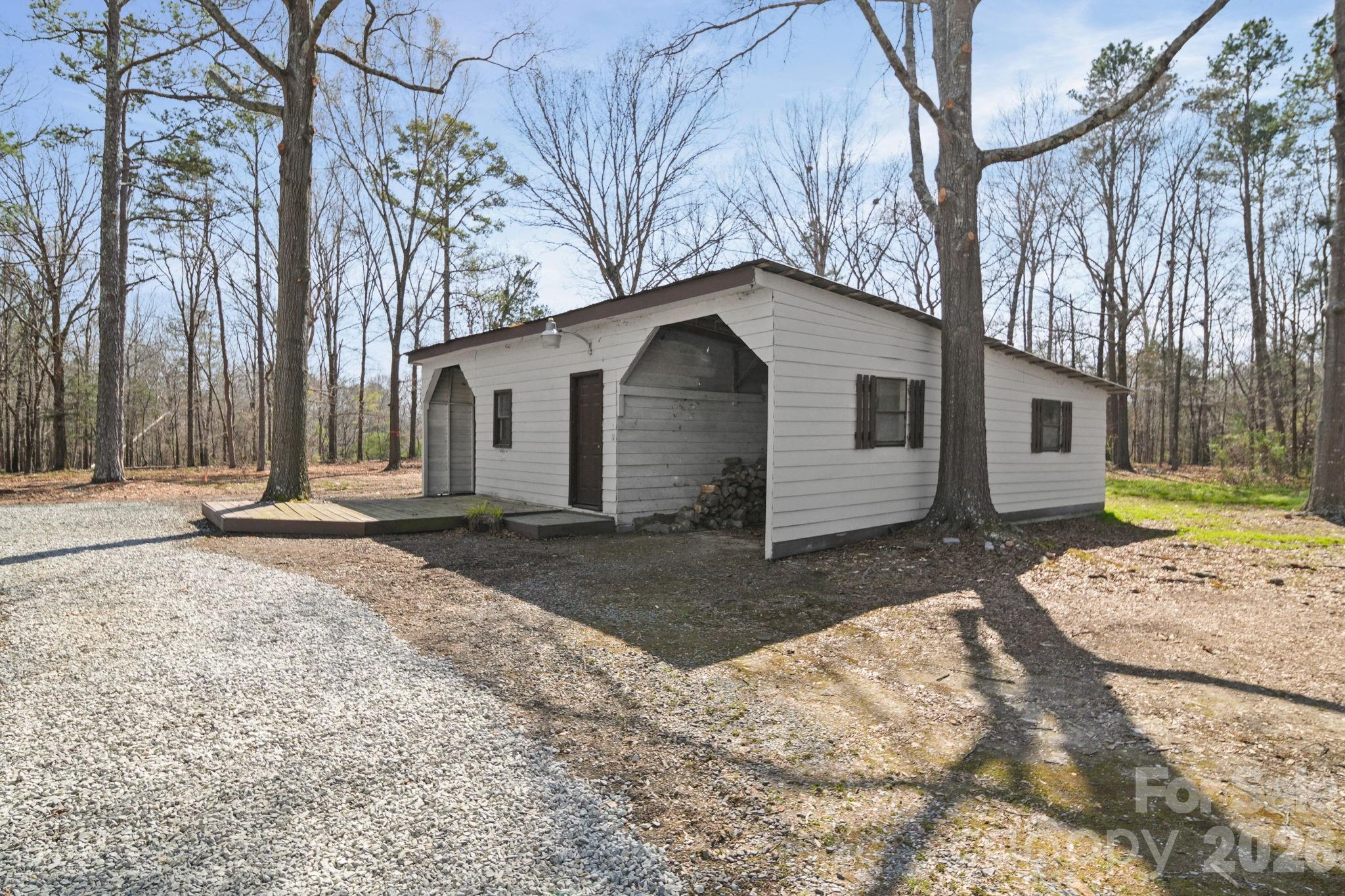 5808 Flint Ridge Marshville, NC 28103 - Photo 3 of 38 a front view of a house with a yard and garage