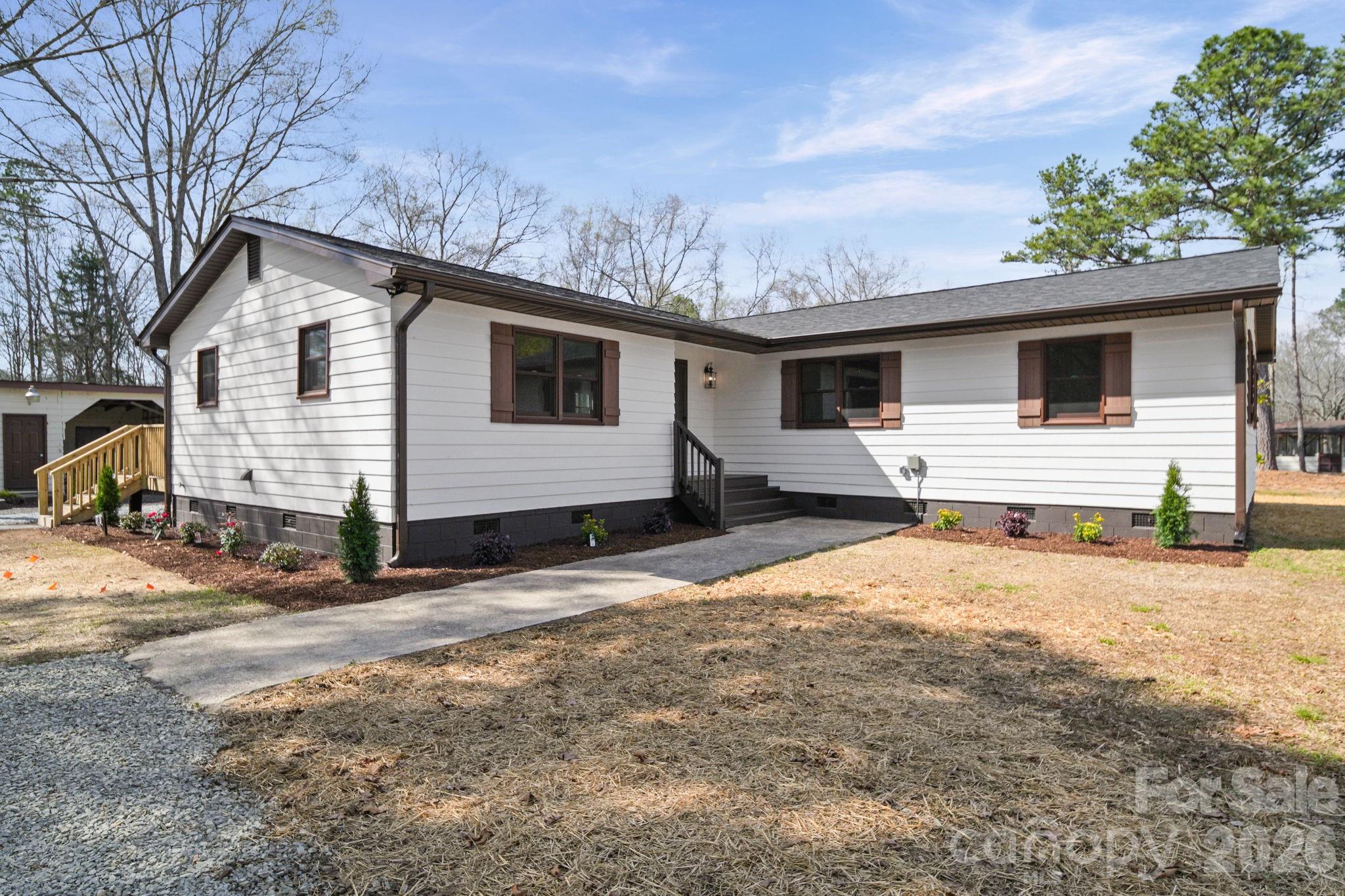 5808 Flint Ridge Marshville, NC 28103 - Photo 4 of 38 a view of a house with a yard
