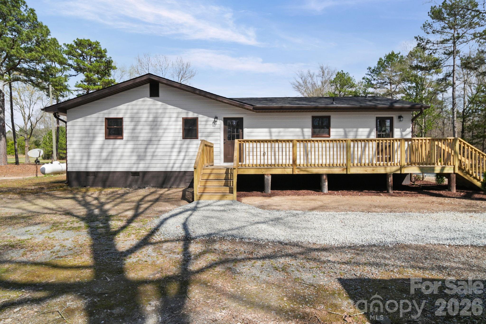 5808 Flint Ridge Marshville, NC 28103 - Photo 7 of 38 a front view of a house with a yard and garage