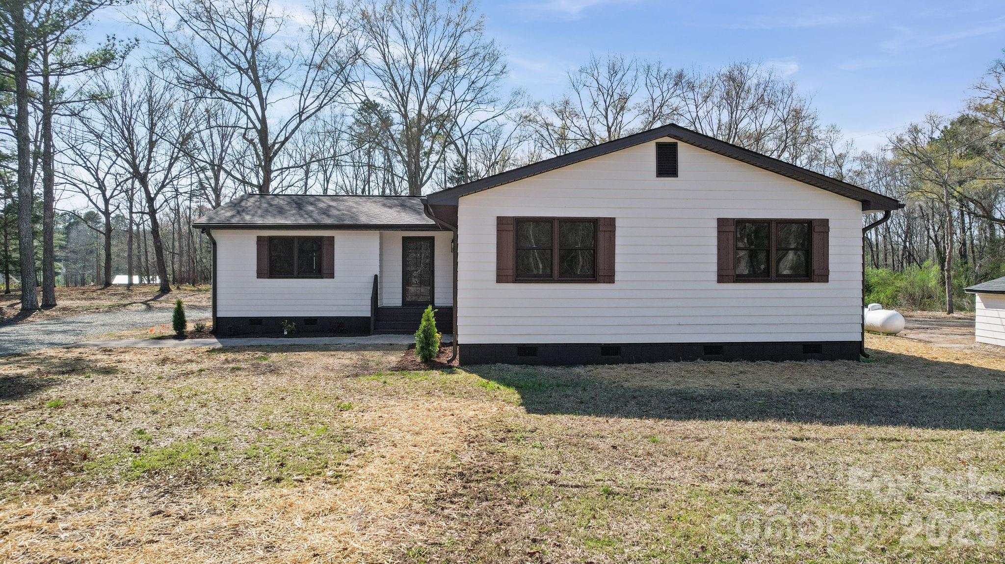 5808 Flint Ridge Marshville, NC 28103 - Photo 9 of 38 a house with trees in the background