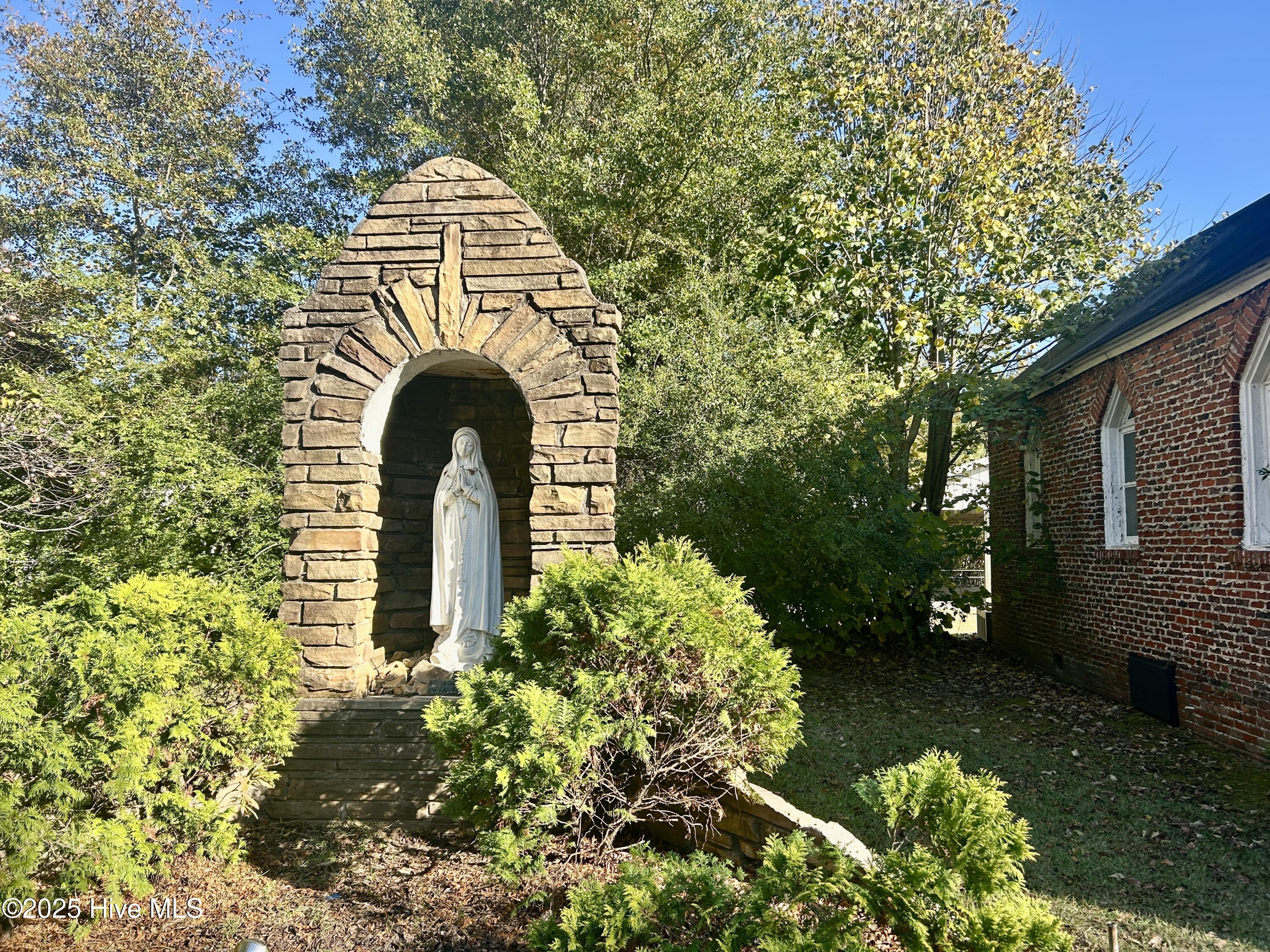 1715 Main Street Scotland Neck, NC 27874 - Photo 2 of 37 grotto with statue of the Virgin Mary