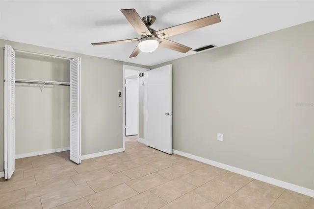 an aerial view of a city with lots of residential buildings and lake view