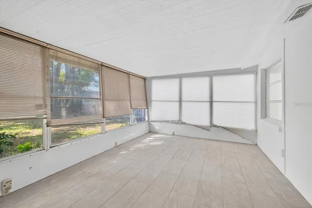 a front view of house with yard and lake