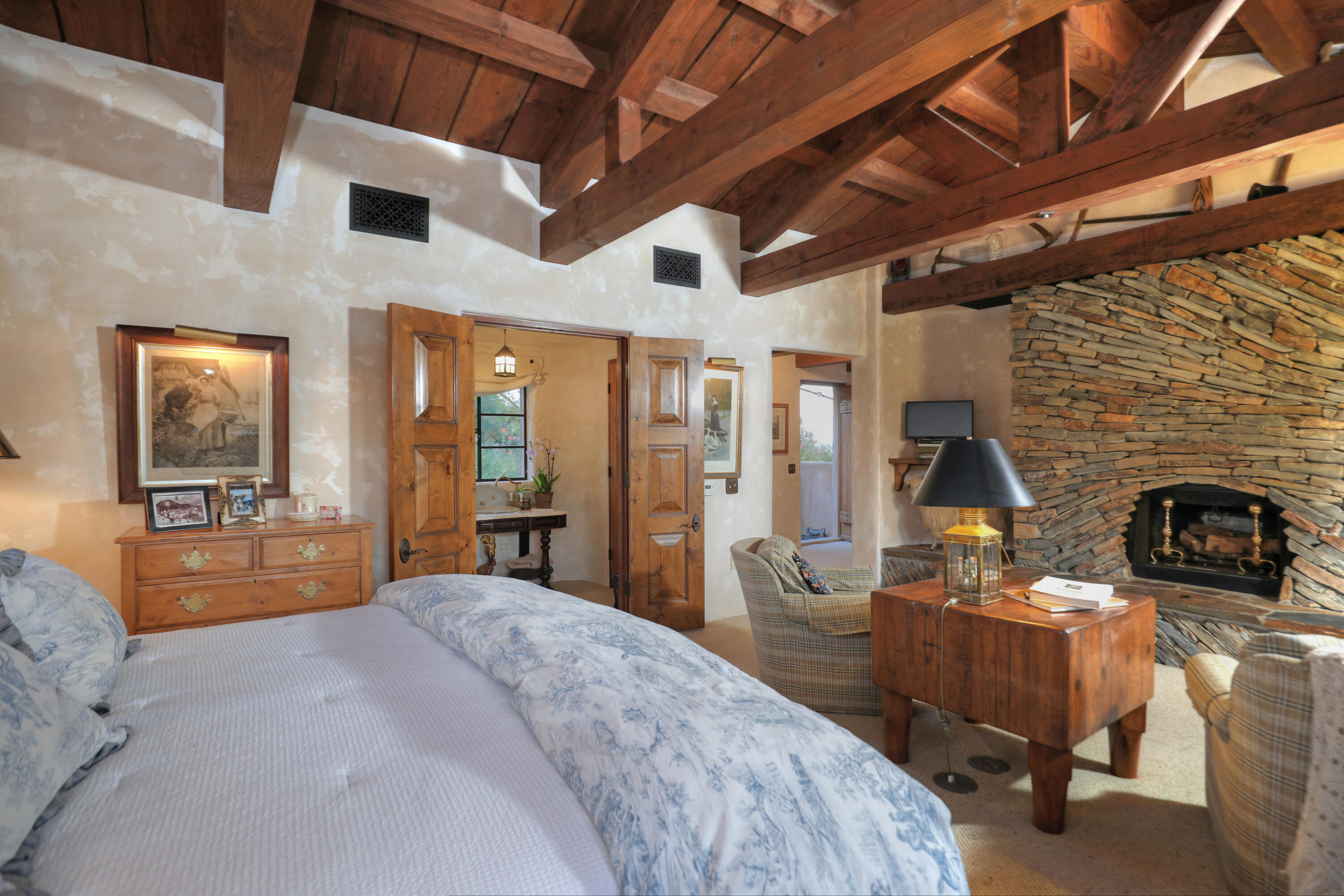 7 Creciente Drive Santa Barbara, CA 93110 - Photo 12 of 16 a bedroom with furniture and a fireplace