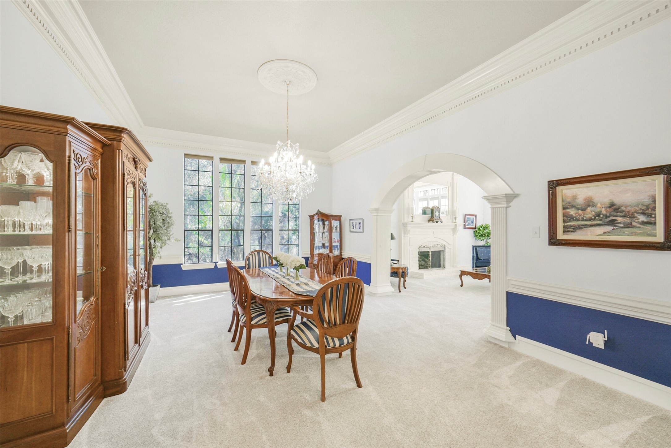 17302 Atherington Place Spring, TX 77379 - Photo 9 of 50 Elegant dining room designed for entertaining, featuring designer lighting and detailed millwork.