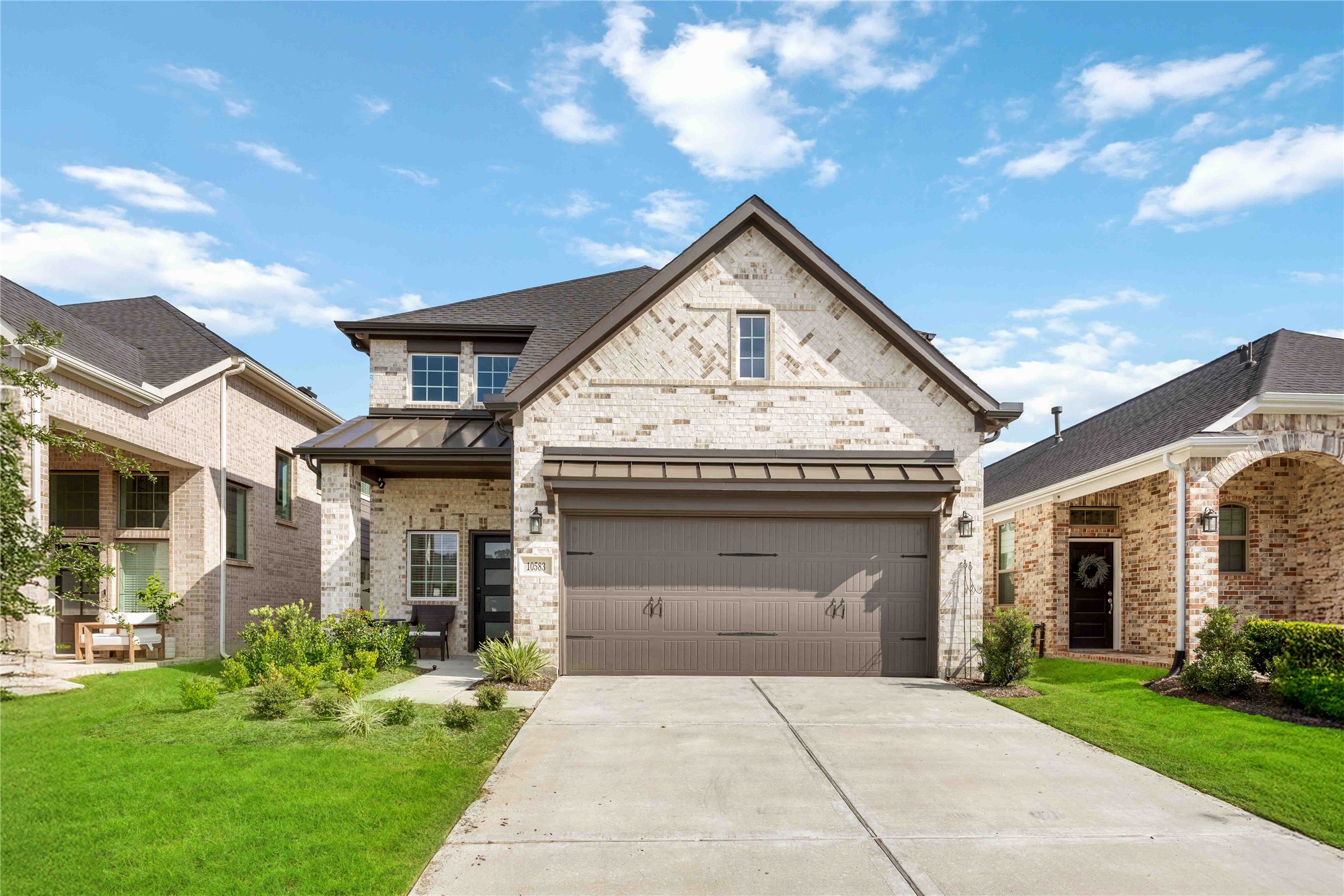 a front view of a house with garden