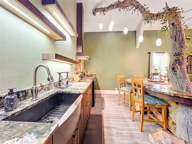 a view of a kitchen with a sink and cabinets