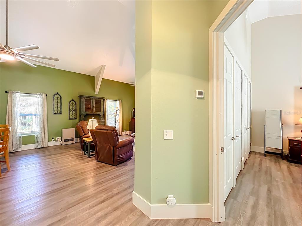 1825 Pams Way Geneva, FL 32732 - Photo 18 of 60 a living room with furniture and a wooden floor