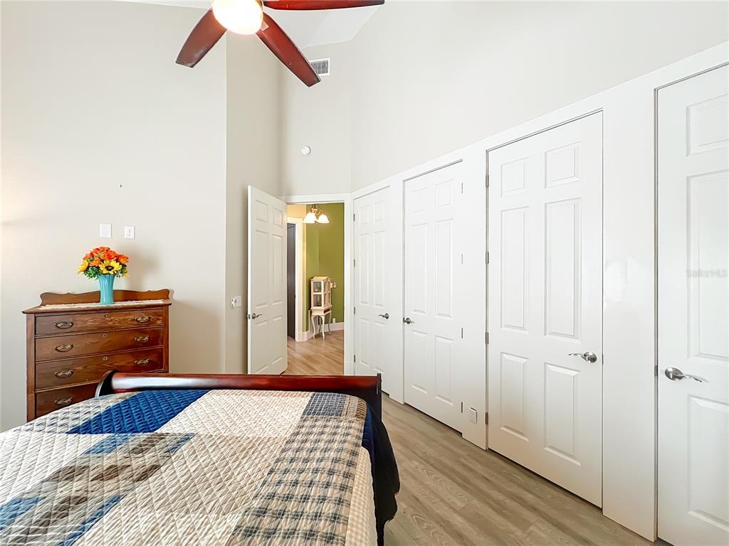 1825 Pams Way Geneva, FL 32732 - Photo 20 of 60 a bedroom with a bed and wooden floor