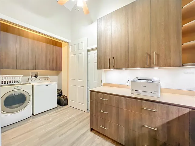 a storage room with lots of clutter and cabinets