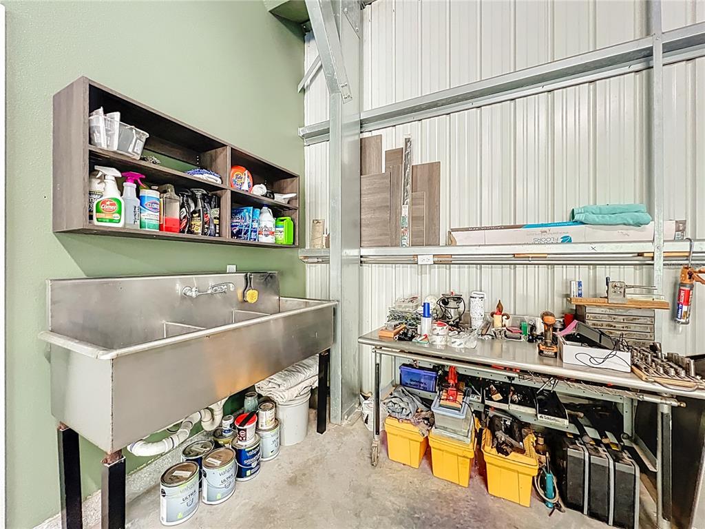 1825 Pams Way Geneva, FL 32732 - Photo 30 of 60 a storage room with lots of clutter and cabinets