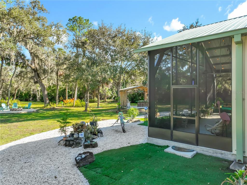 1825 Pams Way Geneva, FL 32732 - Photo 3 of 60 a view of a chair and table in the garden