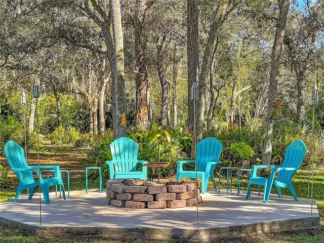 a view of a chairs in a backyard