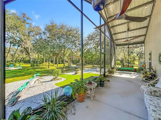 a view of a swimming pool with a patio