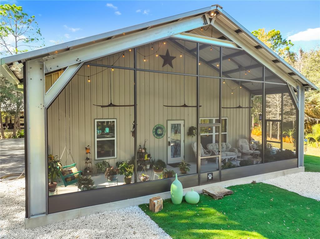 1825 Pams Way Geneva, FL 32732 - Photo 58 of 60 a front view of a house with garden