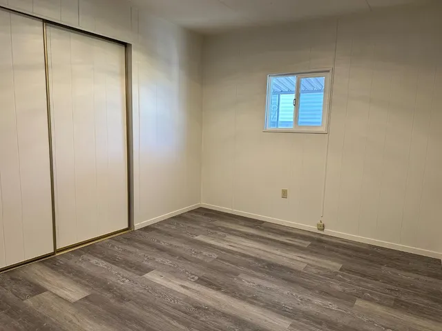 a bathroom with a granite countertop sink a toilet and bathtub