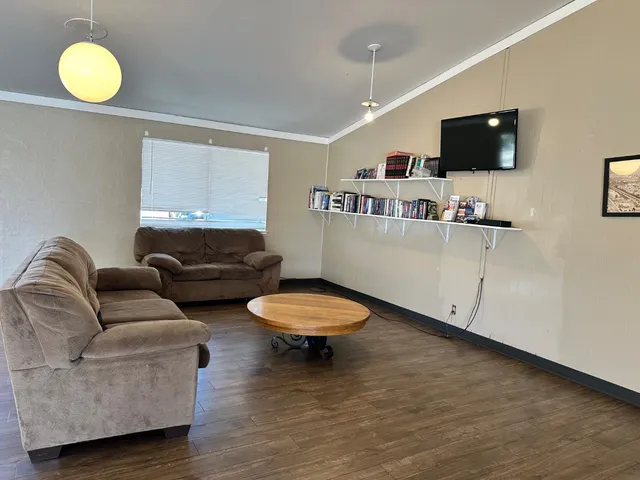 a kitchen with granite countertop a stove and a refrigerator