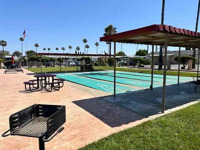a view of a table and chairs under an umbrella