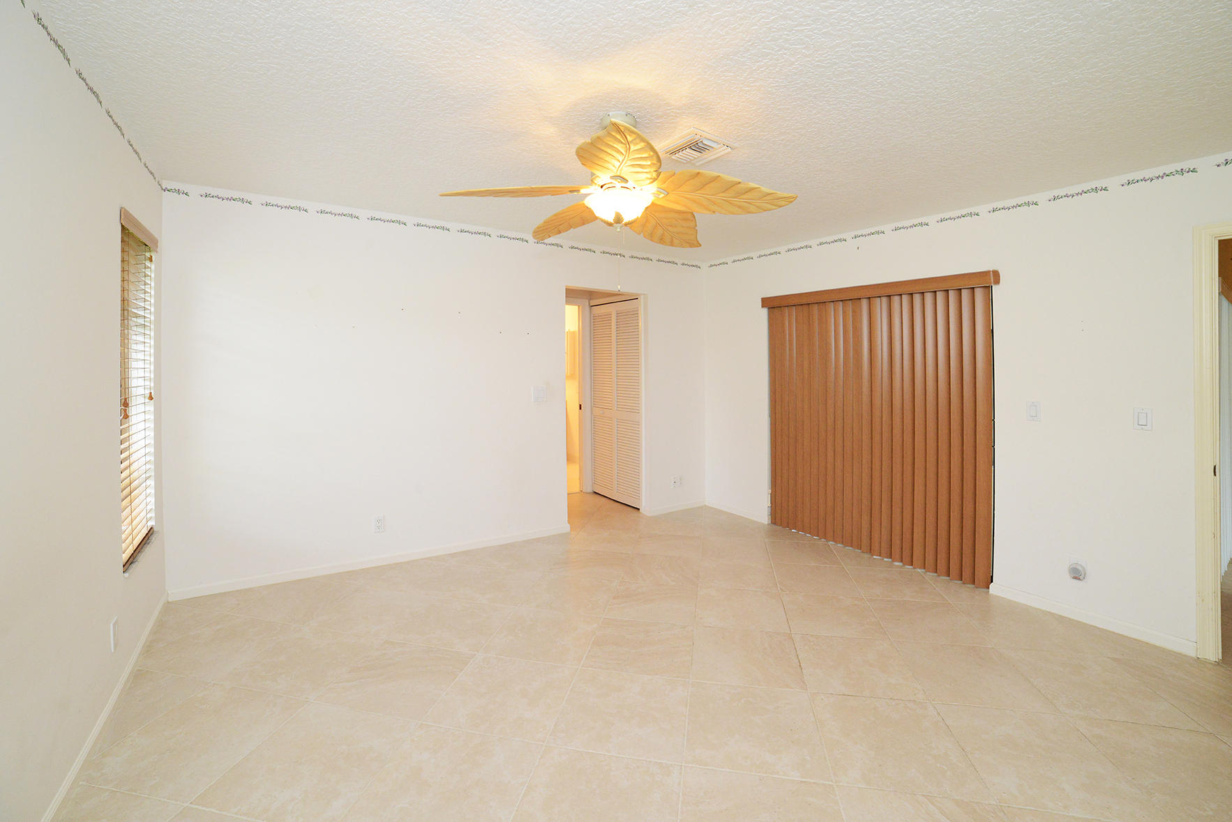 17290 Lake Park Road Boca Raton, FL 33487 - Photo 19 of 28 a view of an empty room with a window