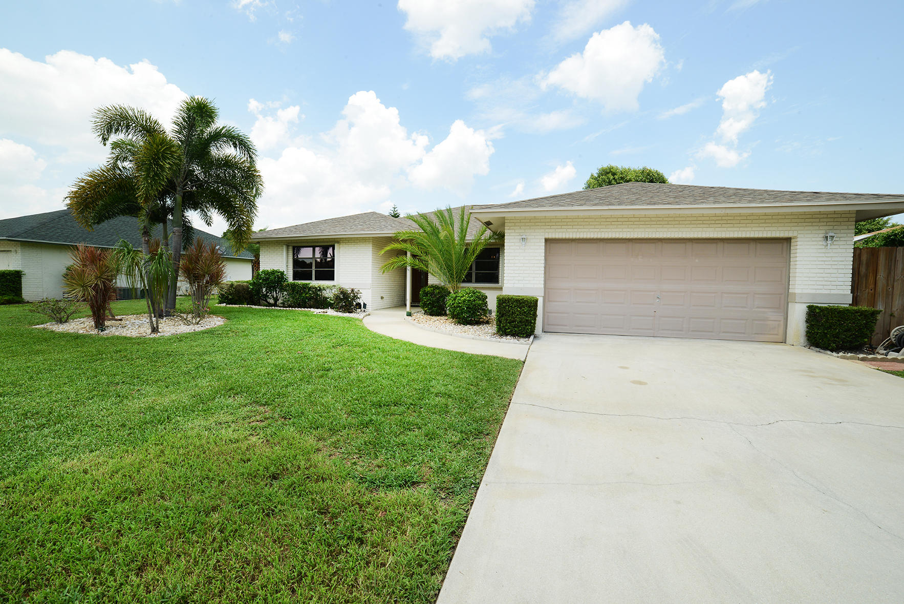 17290 Lake Park Road Boca Raton, FL 33487 - Photo 2 of 28 a front view of house with yard and green space