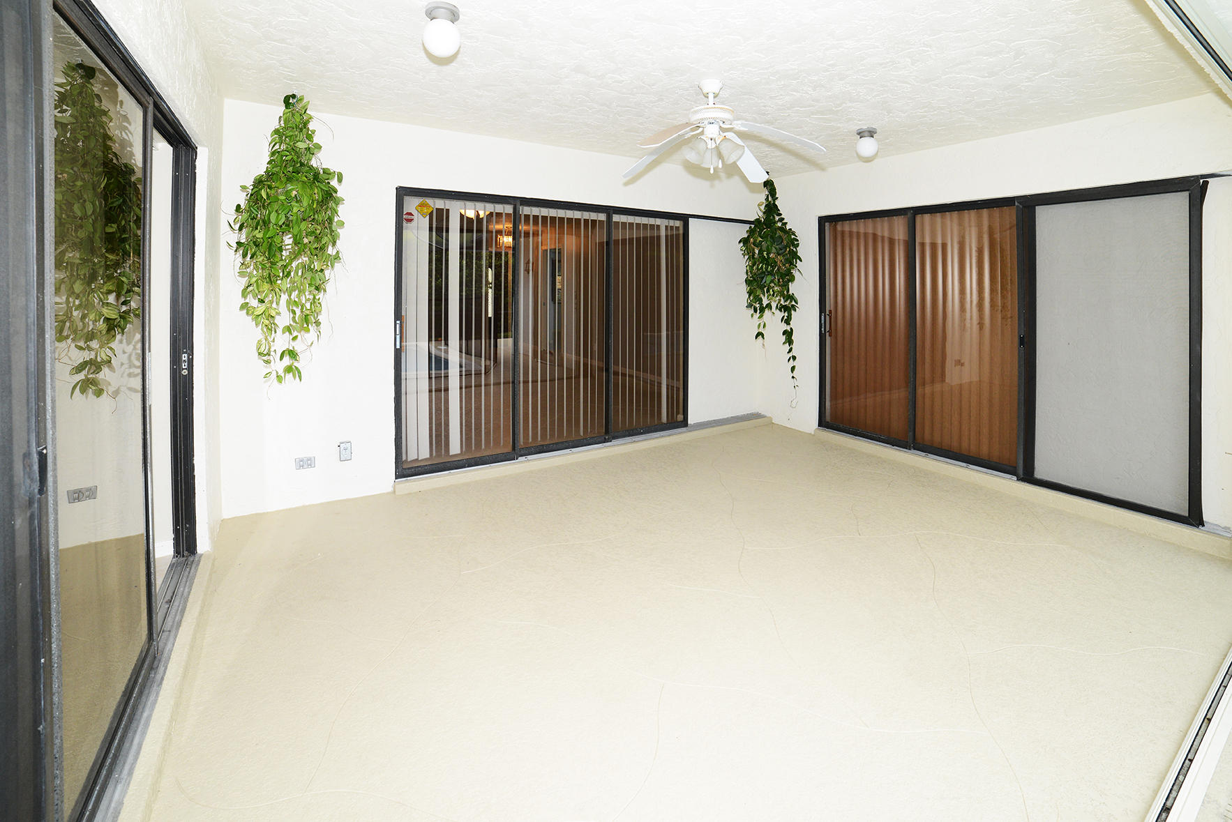 17290 Lake Park Road Boca Raton, FL 33487 - Photo 24 of 28 a view of an empty room with potted plants