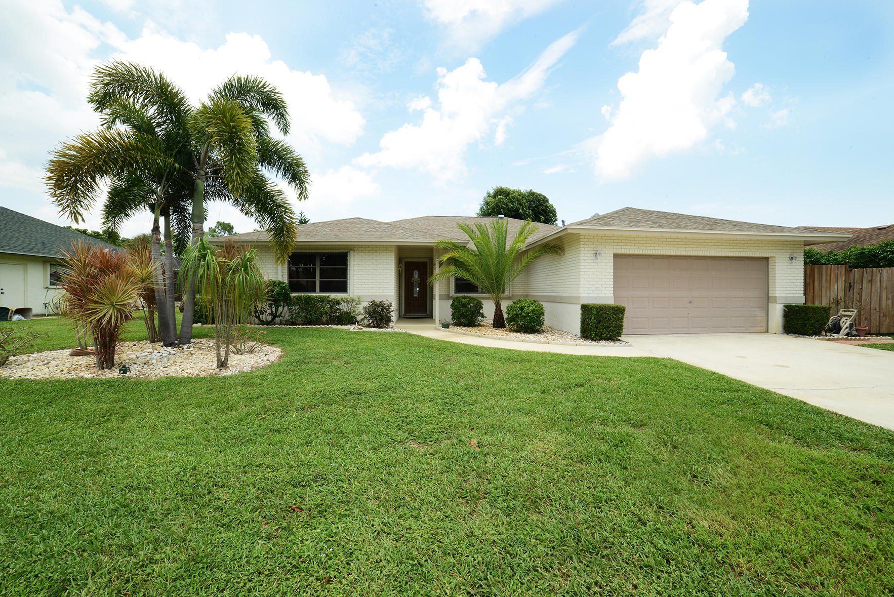 17290 Lake Park Road Boca Raton, FL 33487 - Photo 3 of 28 a front view of house with yard and outdoor seating