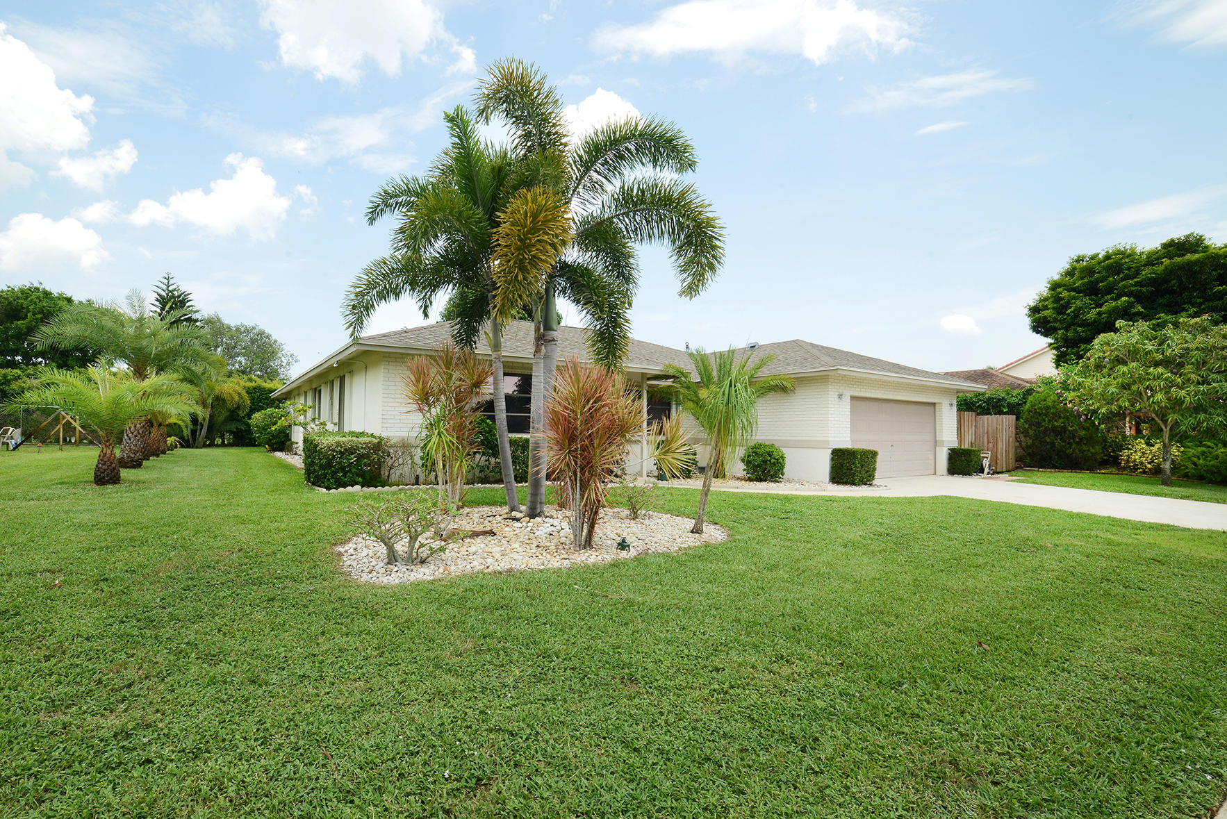 17290 Lake Park Road Boca Raton, FL 33487 - Photo 4 of 28 a front view of house with yard and patio