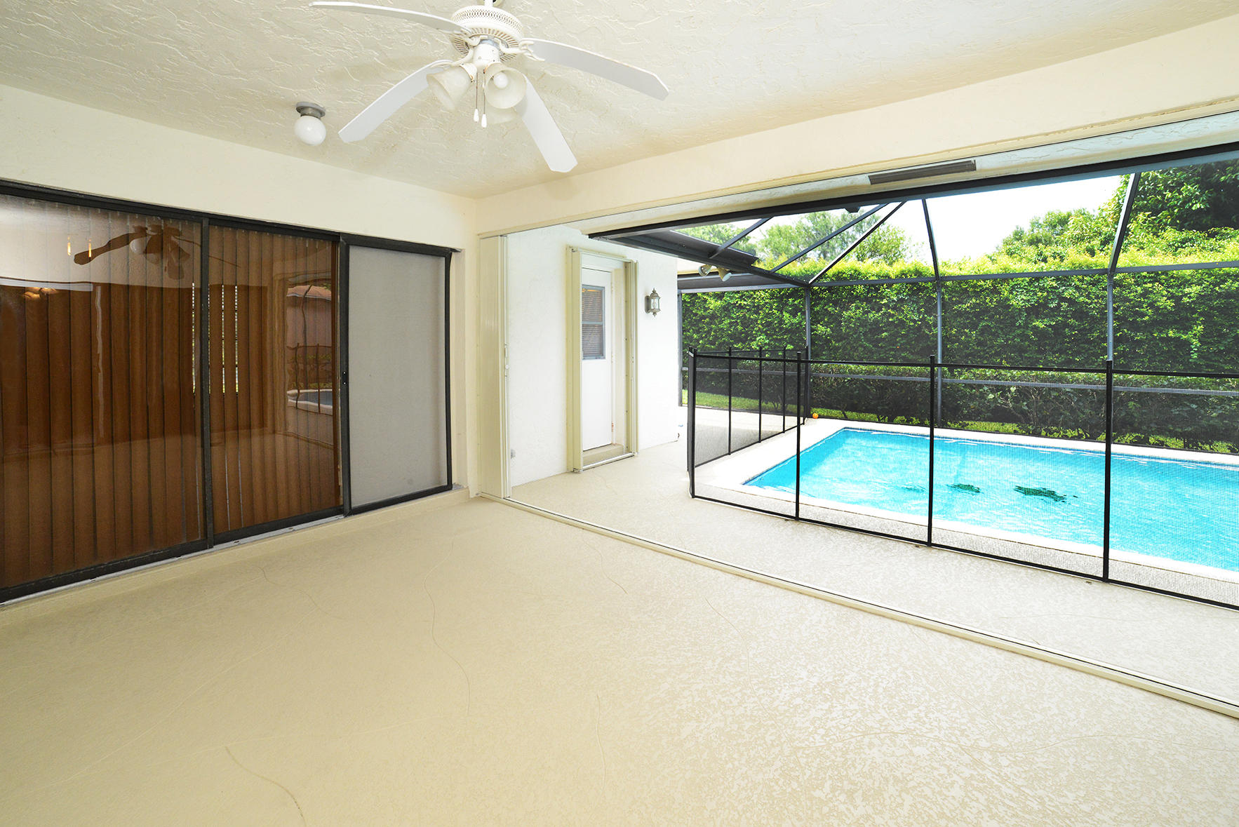 17290 Lake Park Road Boca Raton, FL 33487 - Photo 7 of 28 a view of empty room with sliding door and mountain view