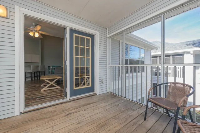 a view of a balcony with furniture