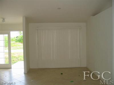 4005 1st Street Southwest Lehigh Acres, FL 33976 - Photo 5 of 5 an empty room with windows