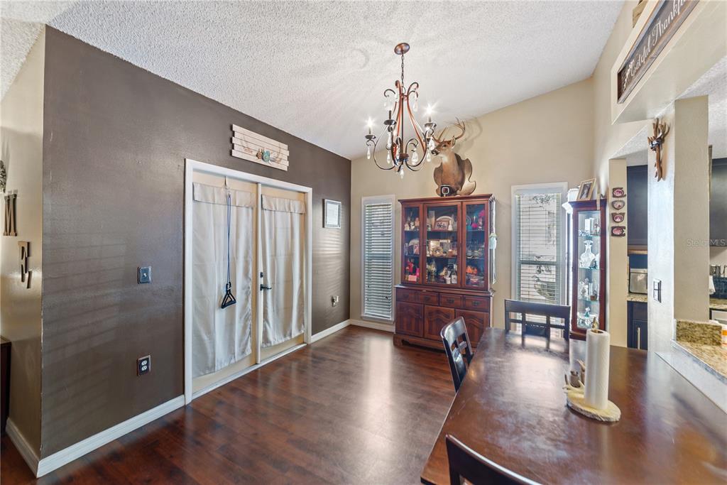 8715 Huntsman Lane Port Richey, FL 34668 - Photo 18 of 54 a view of a livingroom with furniture and hardwood floor