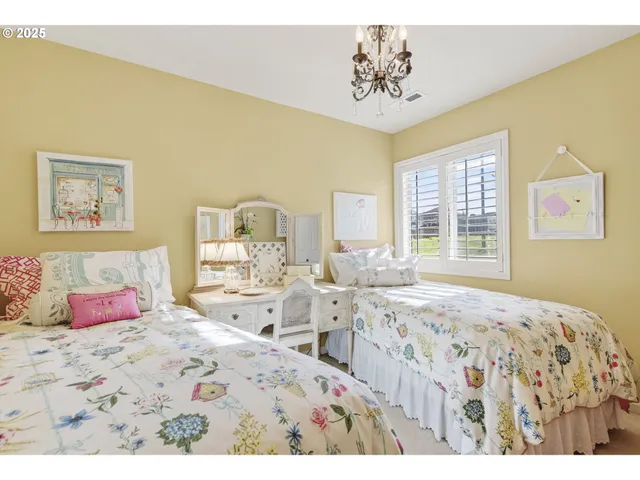 a living room with furniture a window and a flat screen tv