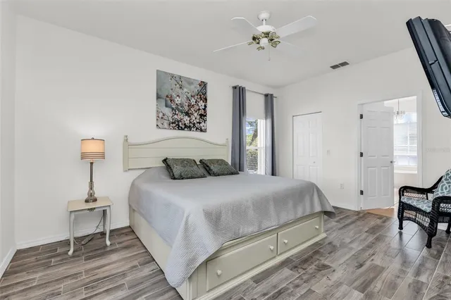 a bedroom with a bed and a table