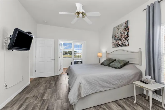 a bedroom with a bed and a television