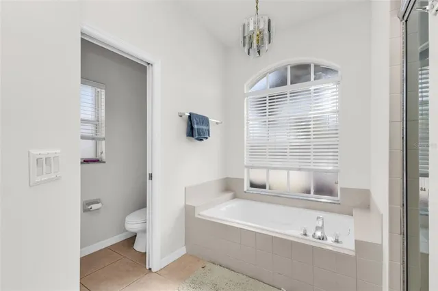 a bathroom with a bathtub sink and toilet