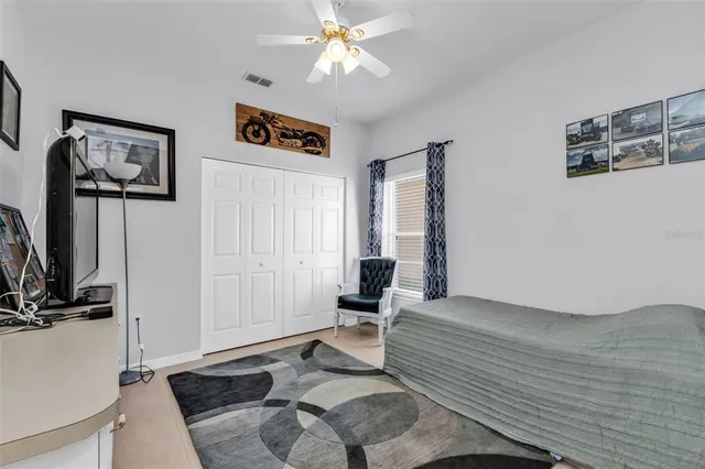 a bathroom with a granite countertop sink toilet a mirror a shower and a bathtub