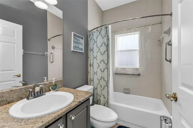 a bedroom with a bed and a cabinet