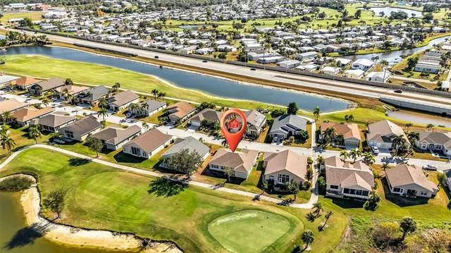an aerial view of a house with a ocean view
